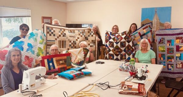 A group of quilters making quilts for Hospice